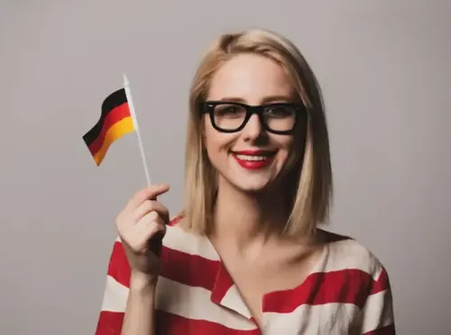 Dziewczyna w okularach z niemiecką flagą